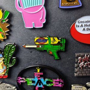 Glow In The Dark Squirt Gun Pin. Limited Edition 400. Hard Enamel (Heady Music)